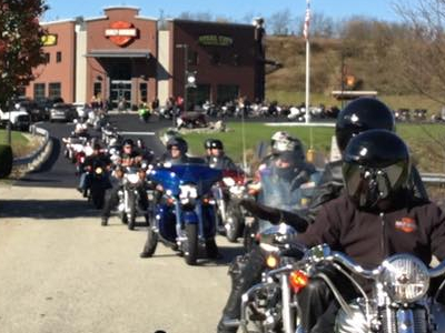 Several motorcyclists driving in row #1